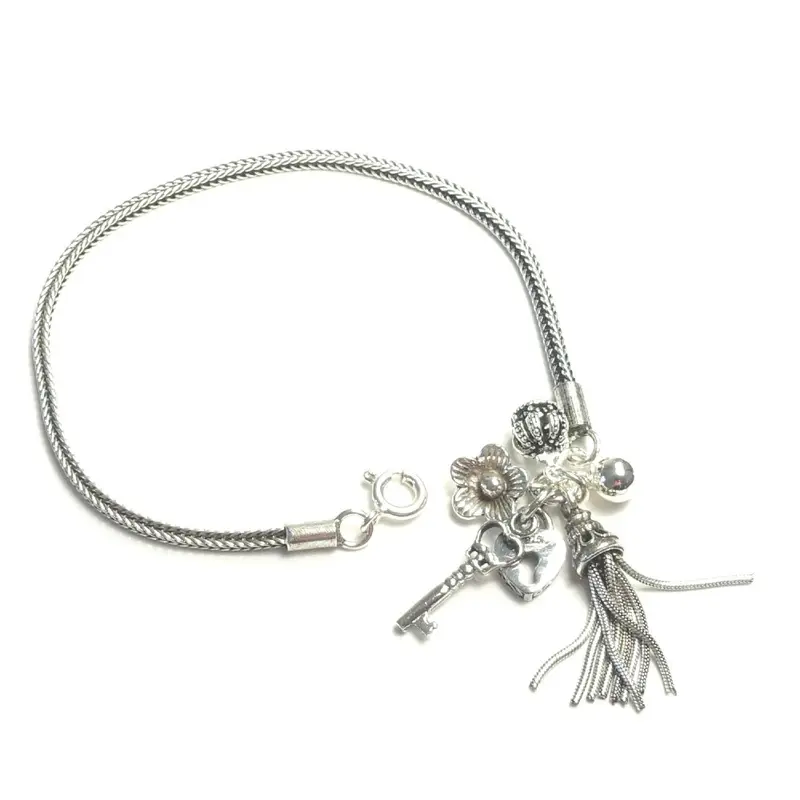 Zilveren armband vol bedels Small
